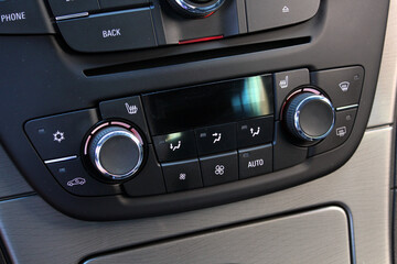 Car climate control. Modern car climate control. Close-up detail with the air conditioning panel inside a car. Modern car interior