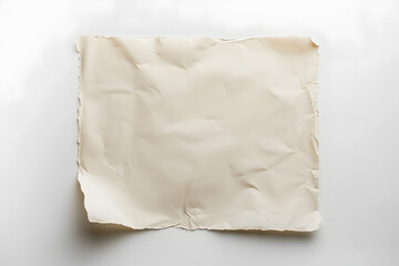 Obraz premium A white background with a piece of paper that is torn and crumpled