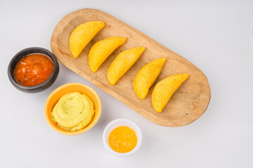 Delicious traditional Colombian empanadas with spicy sauce
