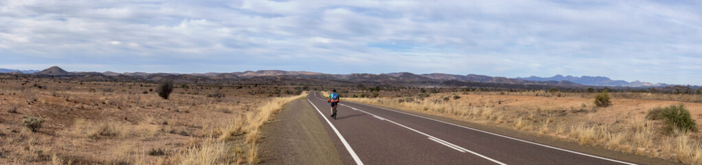 Cyclist on Long Road Through Flinders Ranges