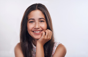 Happy girl, teen and portrait for natural beauty in studio, pigmentation and confidence for melanin. Female person, smile and proud of skin on white background, mockup space and freckles for wellness