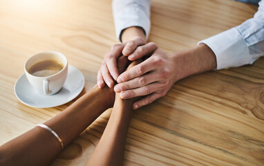 Faith, holding hands and support on table of office, solidarity and of partner in company and...