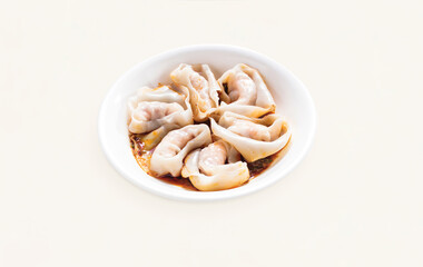 Dumplings, Wontons, Shao Mai, Shrimp and Pork Wontons with spicy Sauce served in plate isolated on grey background side view of hong kong food