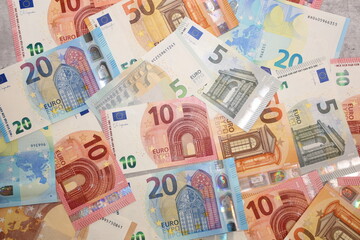 Different denomination Euro bank notes background.