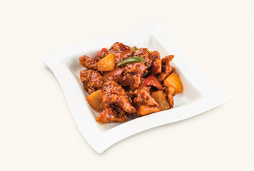 Sweet and Sour Pork served in plate isolated on grey background side view of hong kong food
