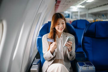 Asian Woman Working on Tablet During  in first class, multitasking with Flight Travel in style, work