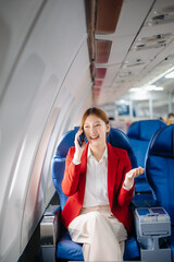 Asian Woman Working on Tablet During  in first class, multitasking with Flight Travel in style, work