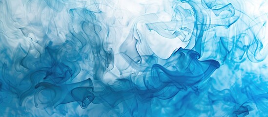 Obraz premium Blue incense smoke creating an abstract background.