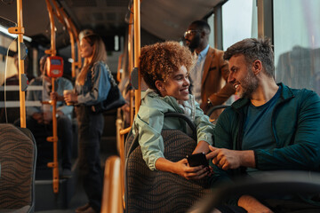 Father and daughter looking at photos on a phone