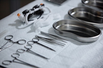 Background image of metal surgical tools laid out on table in operating room at hospital copy space