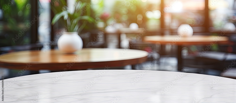 Poster marble table empty with blurred people in a coffee shop background, ideal for product display or onl