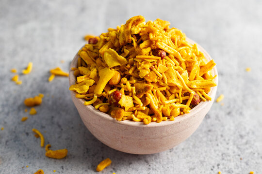 selective focus of Indian snacks Bombay Mix on a bowl. 