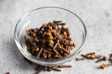 Clove is a fragrant spice from dried flower buds, used for flavouring food, medicinal purposes, and aromatic applications.