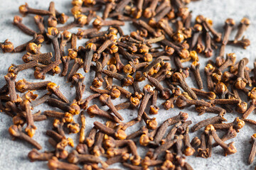 selective focus of Laung Clove, Indian spice with ceramic background. 