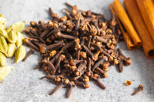 selective focus of Laung Clove, Indian spice with ceramic background. 