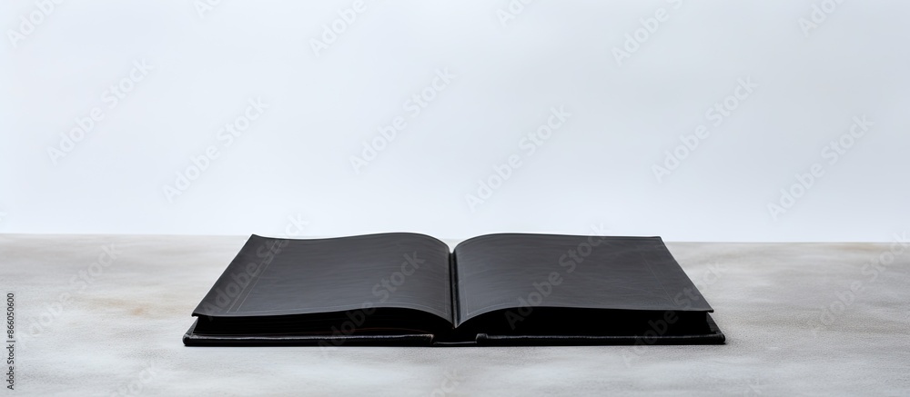 Poster black square book on a white backdrop with copy space image.