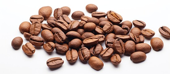 Naklejka premium Coffee beans roasted, set against a white backdrop, with available copy space image.