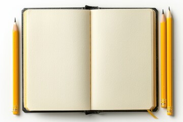 A book with two pencils on top of it