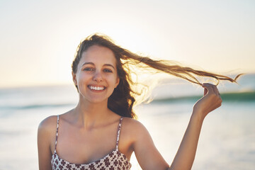 Woman, portrait and freedom at beach on vacation, water and travel to Bali for holiday at sea. Female person, peace and waves on trip in outdoor nature, tropical island and tourist relax by ocean