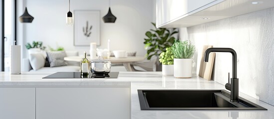 Modern kitchen interior with white elements and a black sink, alongside a bright dining room in a luxurious apartment setting, ideal for meal preparation. Copy space image