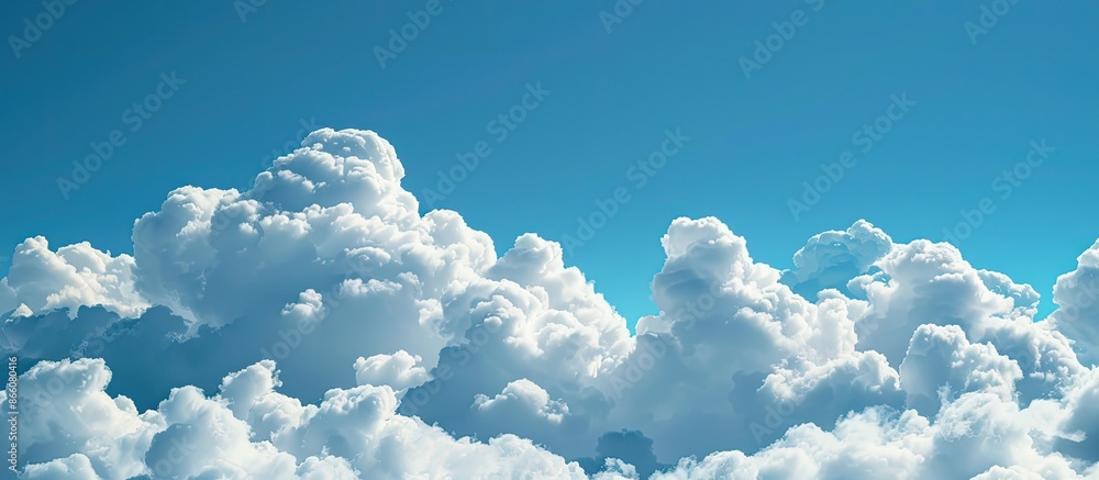 Aufkleber white fluffy clouds float in a clear blue sky providing a perfect textured background with ample cop
