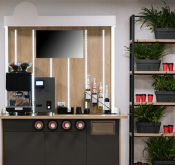 Modern office coffee station with plants