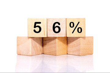 56 PERCENT TEXT ON WOODEN CUBES ON A WHITE BACKGROUND