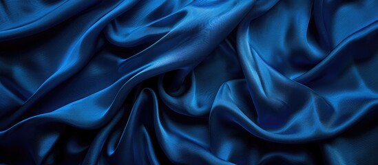 Obraz premium High-resolution photograph of a silk fabric in deep blue shades resembling Bondi blue, suitable for decorating with a textured pattern providing copy space image.
