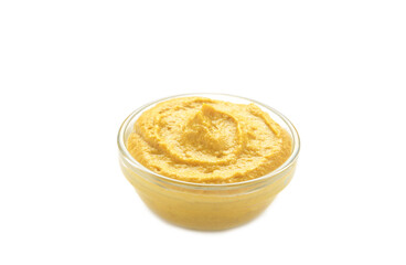 Mustard sauce in glass bowl isolated on white background. Top view. Flat lay