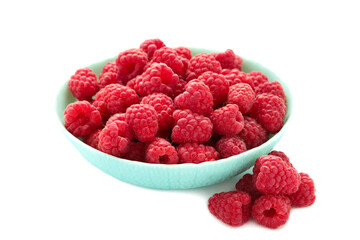 Raspberries in mint bowl isolated on white background
