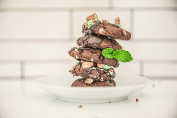 Homemade delicious double chocolate chip mint iced cookies, freshly baked at home with Mum and Daughter