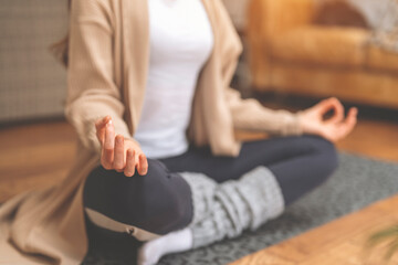 Woman Meditating in Comfortable Home Setting During Day