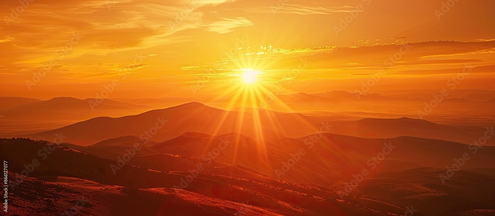 Poster Capture the stunning sunset with a fiery orange sky, offering a picturesque view with plenty of empty space for text or images. image with copy space