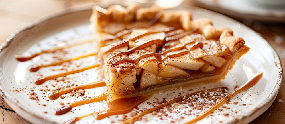 Aufkleber Closeup copy space image of a slice of apple pie drizzled with caramel sauce and sprinkled with cinnamon.