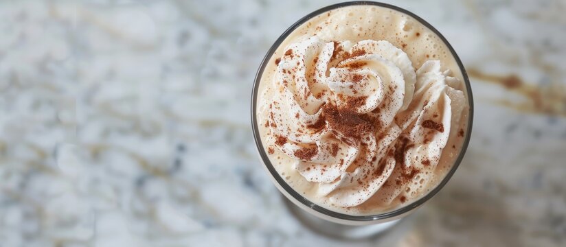 An overhead view of a Greek frappe in a glass, with ample copy space image.