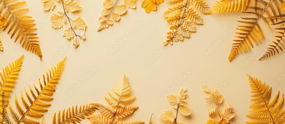 Aufkleber Beige background adorned with top-view yellow autumn fern leaves, creating a flatlay composition with ample copy space image.