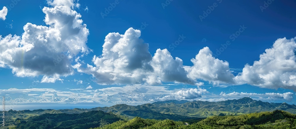 Poster Scenic view with clear blue sky and fluffy white clouds, perfect for a copy space image.