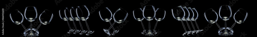 Wall mural Set of empty glasses for red wine isolated on black background.