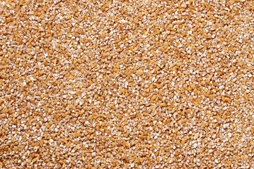 Close-up texture of fine wheat grain top view.