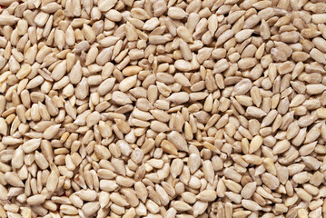 Texture of dried peeled raw sunflower seeds