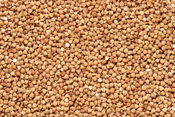 Texture of ripe peeled buckwheat top view .