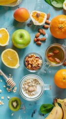 A variety of fresh fruit, nuts, oatmeal, and honey on a blue background