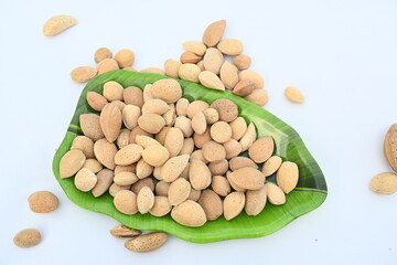 Almond with shell. It's other name Prunus amygdalus and Prunus dulcis. The almond is also the name of the edible and widely cultivated seed of this tree. indian almond.