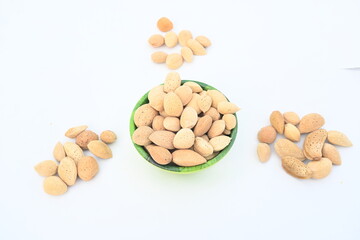 Almond with shell. It's other name Prunus amygdalus and Prunus dulcis. The almond is also the name of the edible and widely cultivated seed of this tree. indian almond.