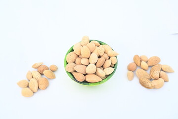 Almond with shell. It's other name Prunus amygdalus and Prunus dulcis. The almond is also the name of the edible and widely cultivated seed of this tree. indian almond.
