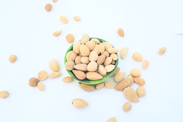 Almond with shell. It's other name Prunus amygdalus and Prunus dulcis. The almond is also the name of the edible and widely cultivated seed of this tree. indian almond.