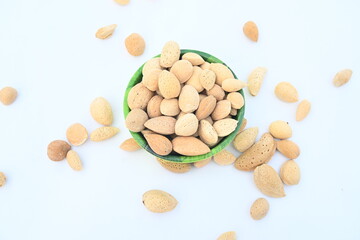 Almond with shell. It's other name Prunus amygdalus and Prunus dulcis. The almond is also the name of the edible and widely cultivated seed of this tree. indian almond.