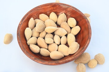 Almond with shell. It's other name Prunus amygdalus and Prunus dulcis. The almond is also the name of the edible and widely cultivated seed of this tree. indian almond.