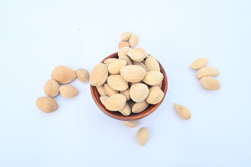 Almond with shell. It's other name Prunus amygdalus and Prunus dulcis. The almond is also the name of the edible and widely cultivated seed of this tree. indian almond.