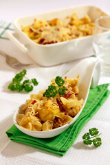 Filled pasta with cheese and ham.